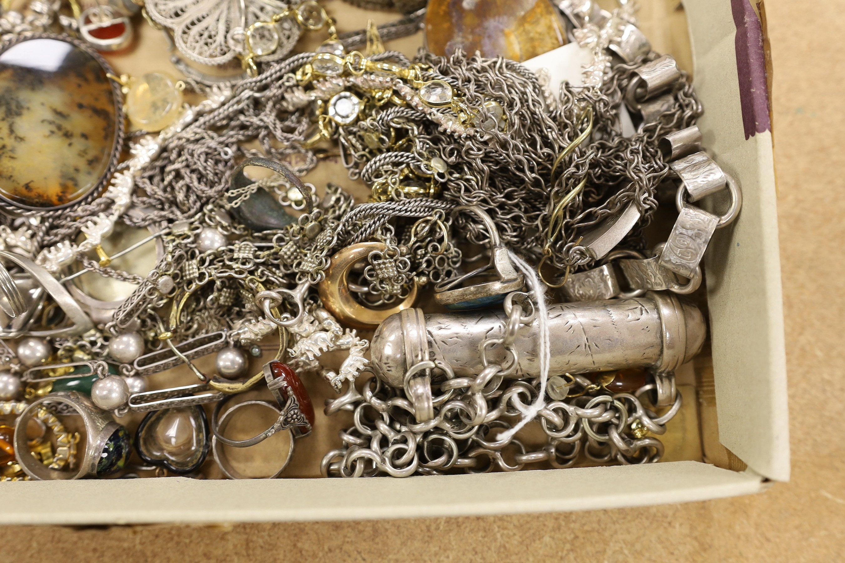 A collection of assorted 19th century and later jewellery, including Middle Eastern white metal canister in chain, yellow metal eat studs and other items including rings, toothpick, necklaces, silver stamp case etc.